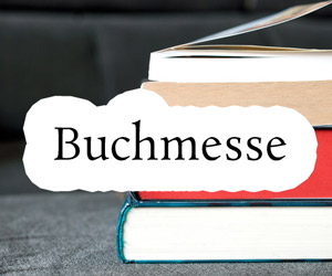 Schmuckbild mit Bücherstapel, darüber der Test: "Buchmesse"